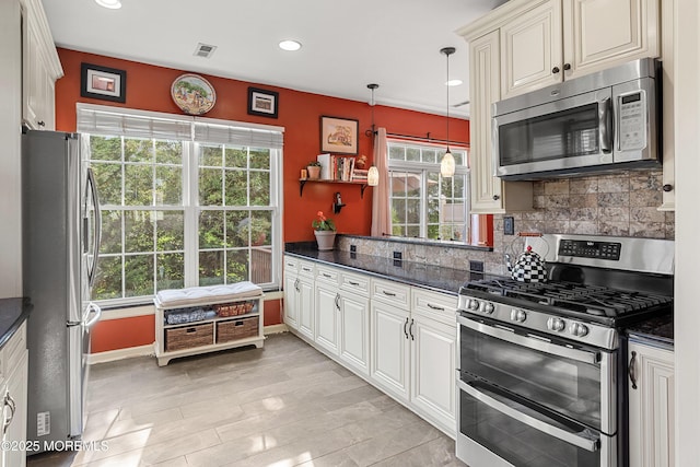 66 Banyan Blvd, Holmdel, NJ 07733 - kitchen with stainless steel appliances, backsplash, recessed lighting, decorative light fixtures, and dark stone countertops