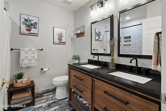66 Banyan Blvd, Holmdel, NJ 07733 - bathroom featuring double vanity, wood finished floors, and a shower with shower curtain