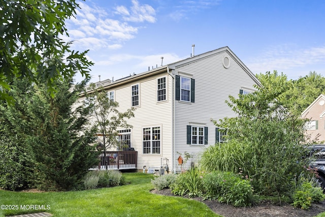 66 Banyan Blvd, Holmdel, NJ 07733 - rear view of house with a yard and a wooden deck