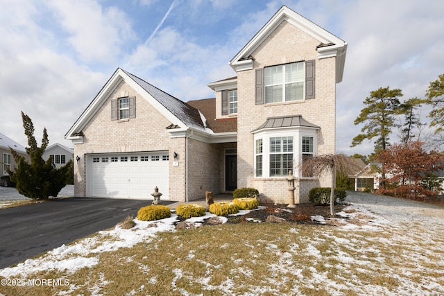 front of property with a garage