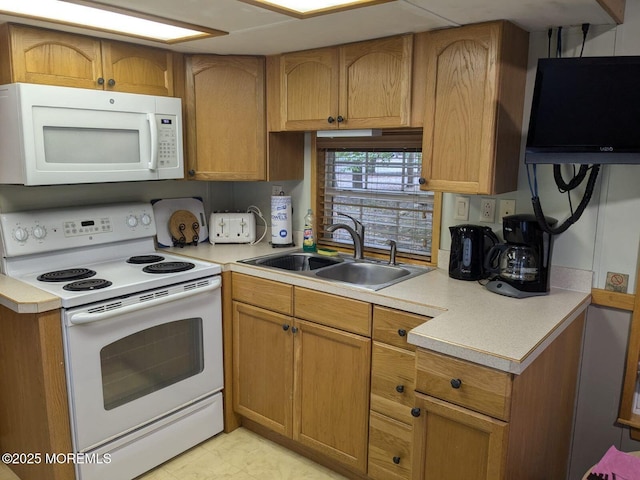 kitchen with white appliances and sink