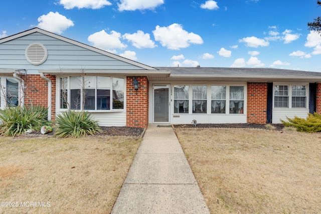 ranch-style house with a front lawn