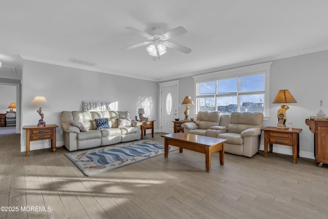 living room with crown molding, ceiling fan, and light hardwood / wood-style floors