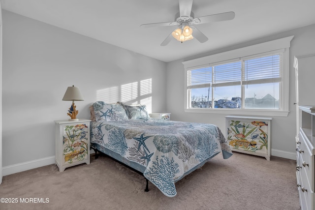 bedroom with light colored carpet and ceiling fan