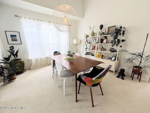 dining room featuring carpet flooring and a wealth of natural light