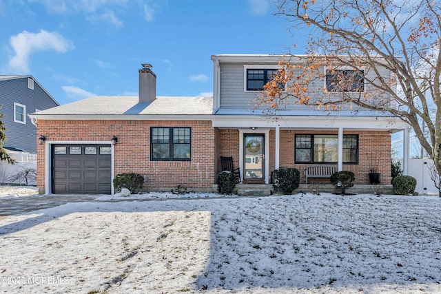 view of front of house with a garage and a porch