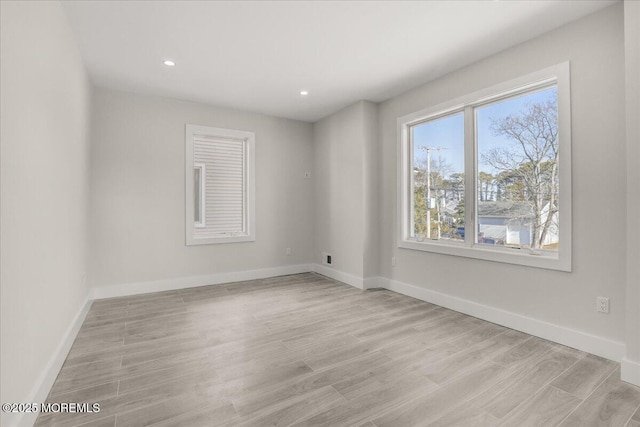 empty room with light hardwood / wood-style floors