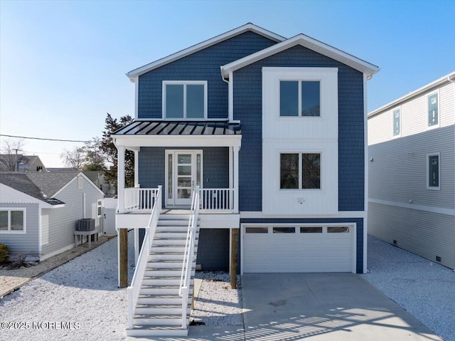 view of front of property with a garage and a porch