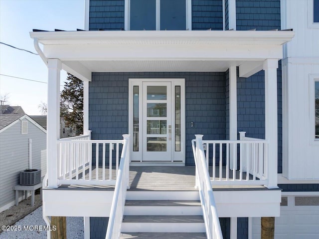 view of exterior entry featuring a porch