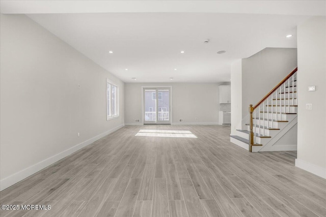 unfurnished living room featuring light hardwood / wood-style flooring