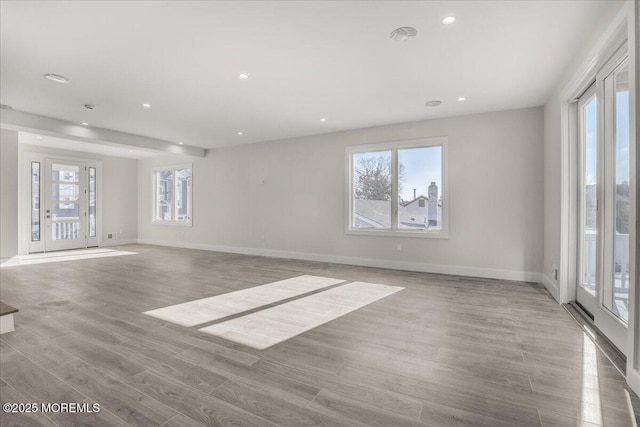 spare room with light hardwood / wood-style floors