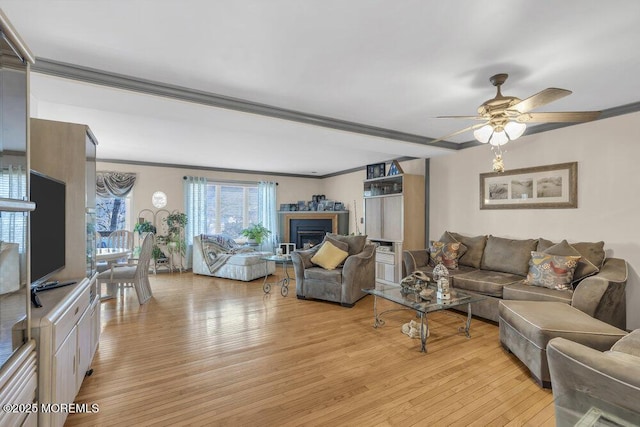 105 Geranium Ct, Toms River, NJ 08753 - living area featuring light wood-style floors, crown molding, ceiling fan, and a fireplace