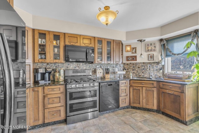 105 Geranium Ct, Toms River, NJ 08753 - kitchen featuring black appliances, brown cabinets, backsplash, and dark stone counters