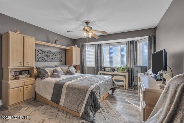105 Geranium Ct, Toms River, NJ 08753 - bedroom featuring a ceiling fan and light wood-style floors