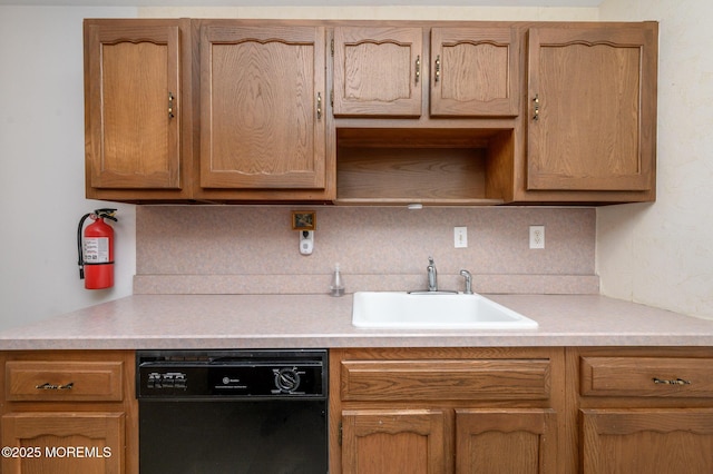 kitchen with black dishwasher, sink, and decorative backsplash