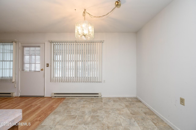 entryway featuring an inviting chandelier and a baseboard radiator