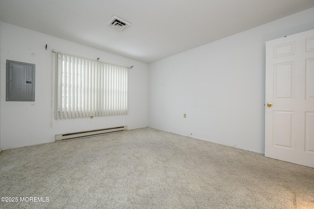 spare room featuring baseboard heating, light colored carpet, and electric panel