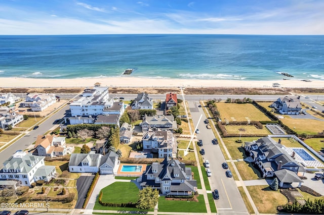 drone / aerial view with a view of the beach and a water view