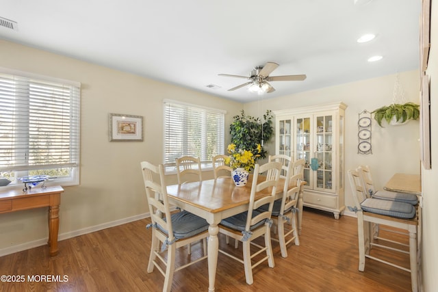 dining room featuring hardwood / wood-style floors and ceiling fan