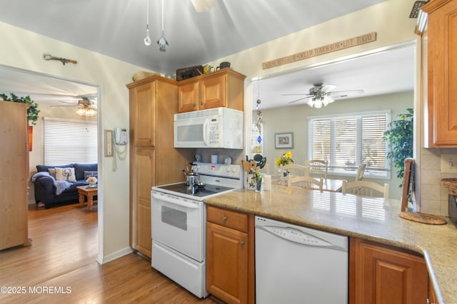 kitchen with backsplash, white appliances, ceiling fan, and light wood-type flooring