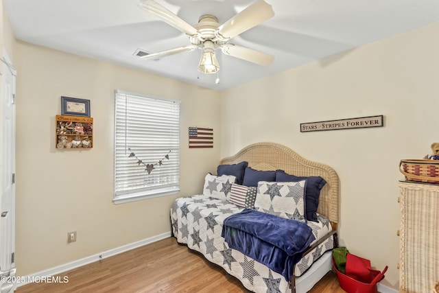 bedroom with ceiling fan and hardwood / wood-style floors