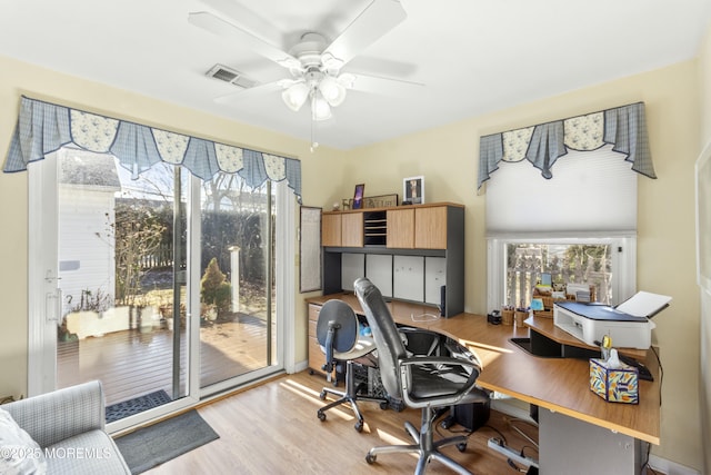 office area featuring light hardwood / wood-style flooring and ceiling fan