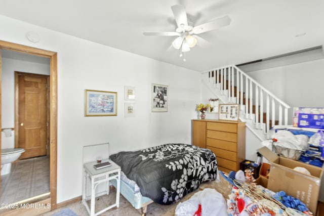 bedroom with ensuite bathroom and ceiling fan