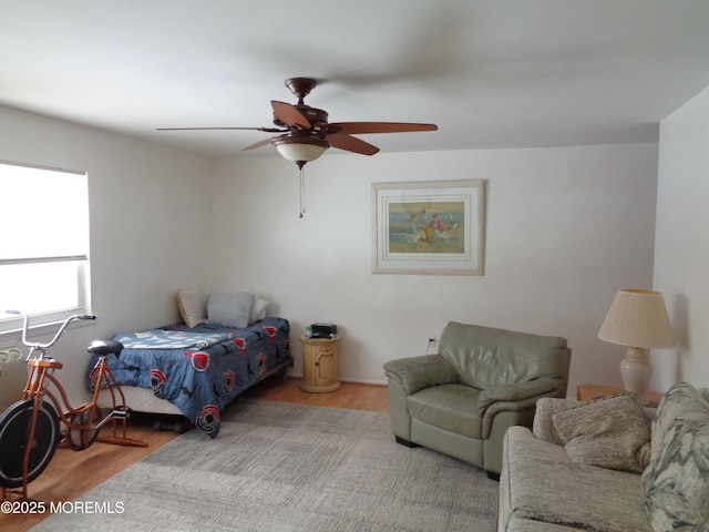 bedroom with light hardwood / wood-style flooring and ceiling fan