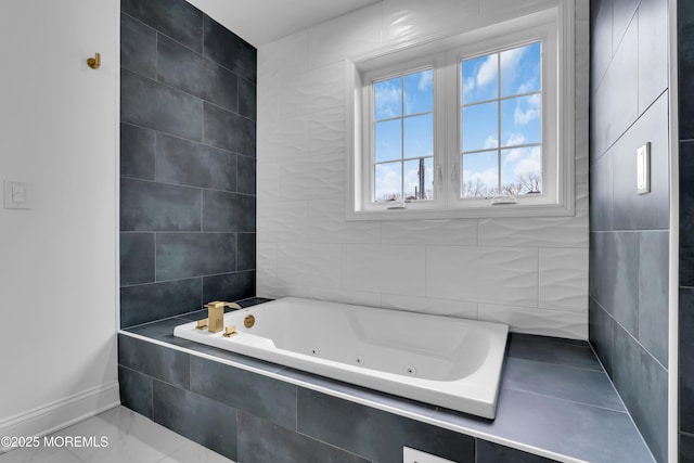 bathroom featuring tiled tub