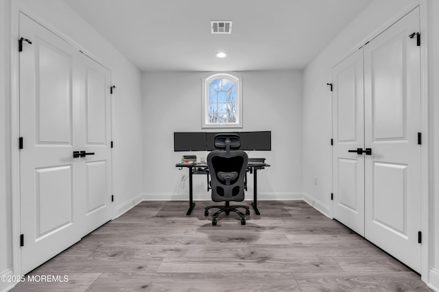 home office featuring light hardwood / wood-style floors