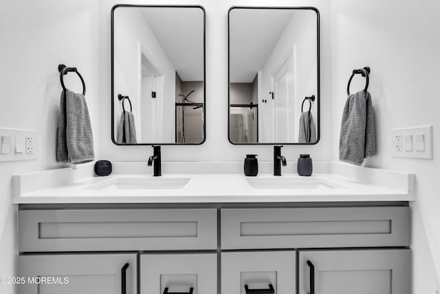 bathroom featuring vanity and an enclosed shower