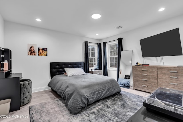 bedroom with light hardwood / wood-style floors