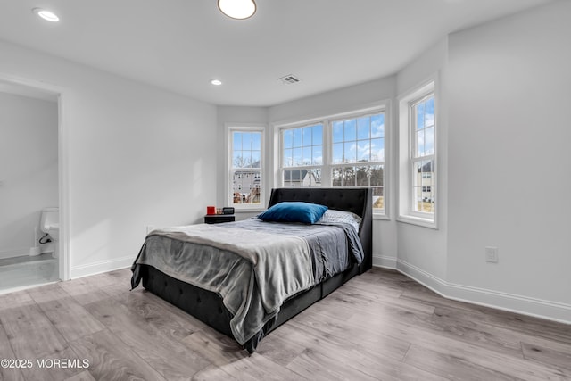 bedroom with light hardwood / wood-style flooring