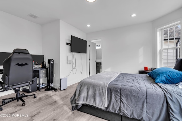 bedroom with light wood-type flooring