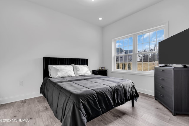 bedroom featuring light wood-type flooring