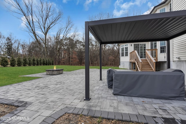 view of patio featuring a fire pit