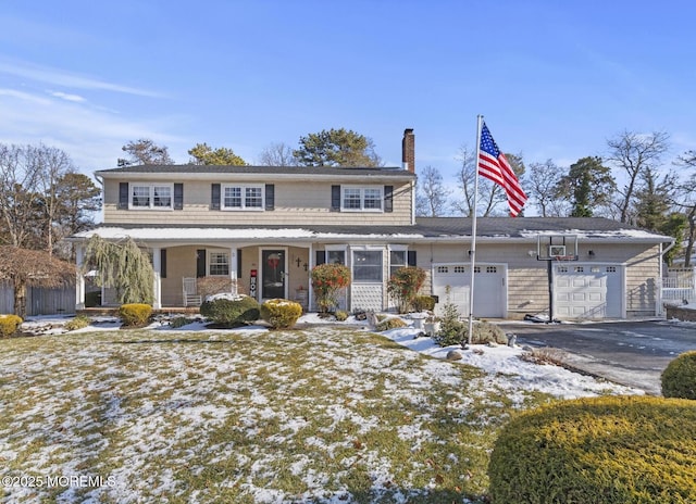 view of front of home with a porch and a garage