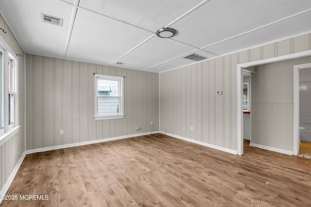 spare room with hardwood / wood-style flooring