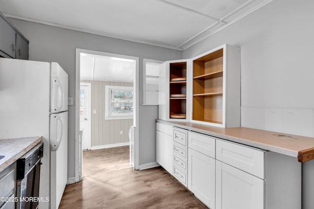 kitchen featuring white cabinetry, light hardwood / wood-style floors, dishwasher, and white fridge