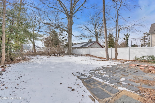 view of yard covered in snow