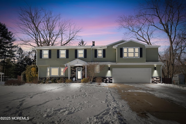 view of front of property featuring a garage