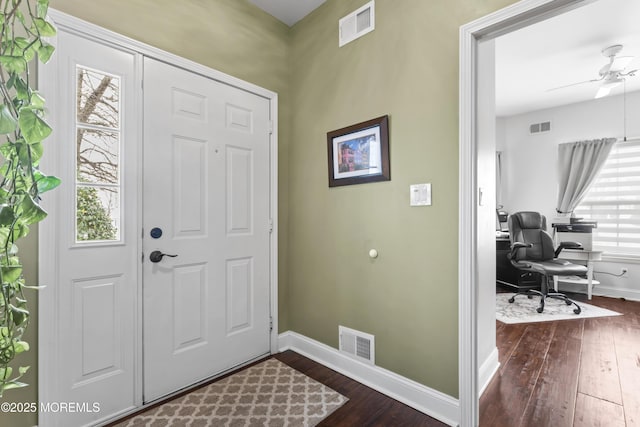 entryway with ceiling fan, dark hardwood / wood-style flooring, and a wealth of natural light