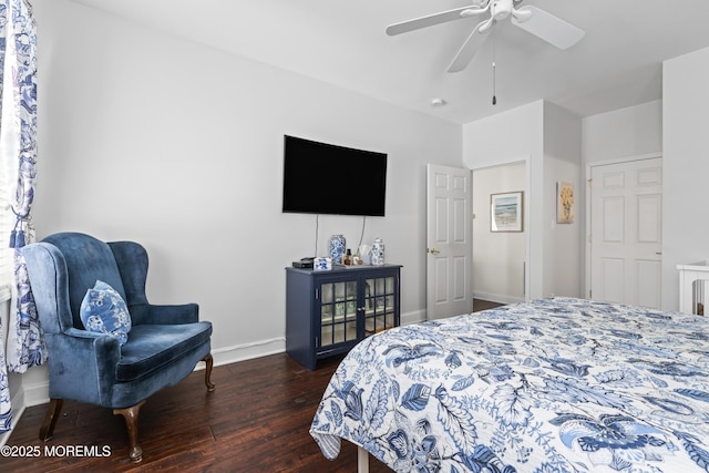 bedroom with dark wood-type flooring and ceiling fan