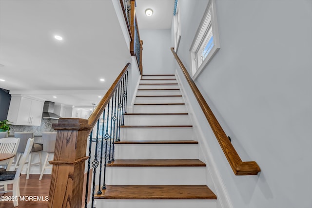 stairway featuring hardwood / wood-style floors