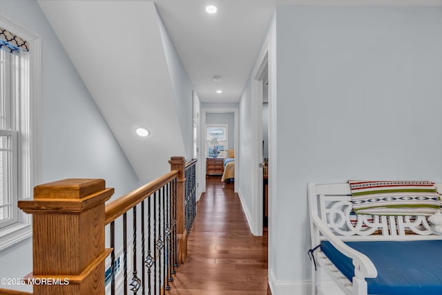 hallway with dark hardwood / wood-style flooring