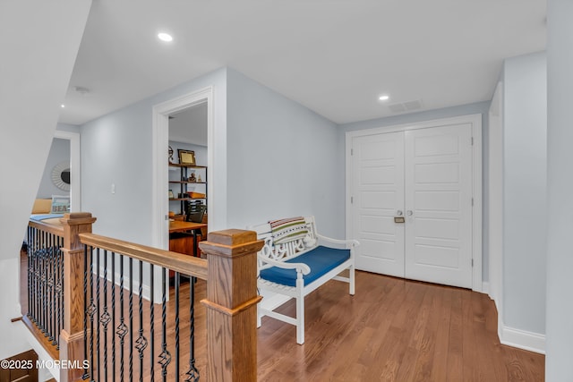 corridor featuring hardwood / wood-style floors