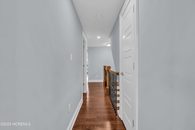 hall with dark hardwood / wood-style flooring