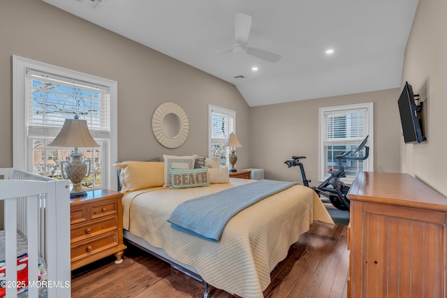 bedroom featuring lofted ceiling, hardwood / wood-style flooring, and ceiling fan