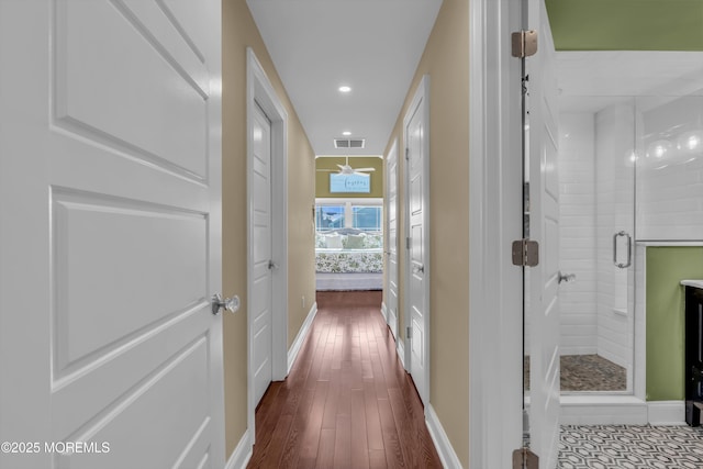 hallway with wood-type flooring