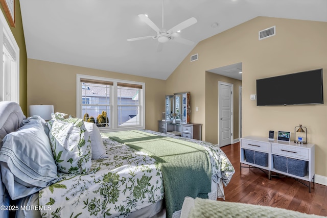 bedroom featuring dark hardwood / wood-style flooring, lofted ceiling, and ceiling fan